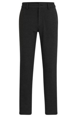 Pantalones slim fit de material t&eacute;cnico el&aacute;stico estructurado, Negro