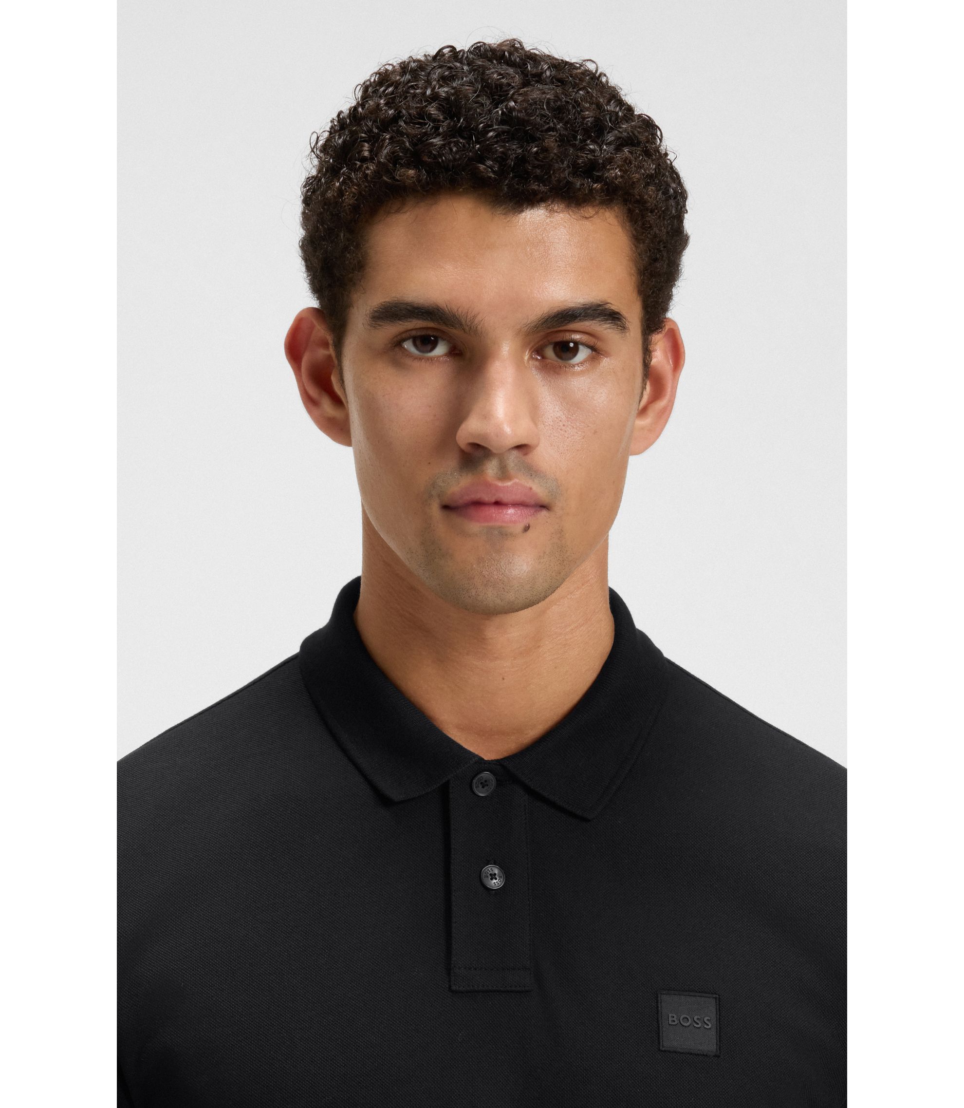 BOSS - Logo-patch slim-fit polo shirt in stretch cotton - Black