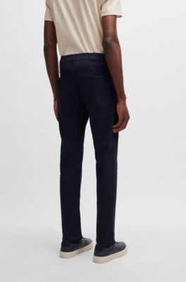 BOSS - Porsche x BOSS tapered-fit jeans in blue denim - Dark Blue