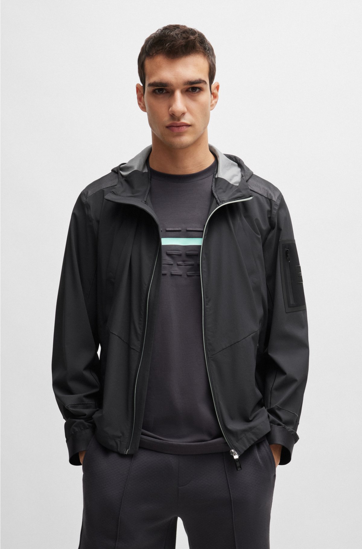 Mixed-material hooded jacket with patterned trims