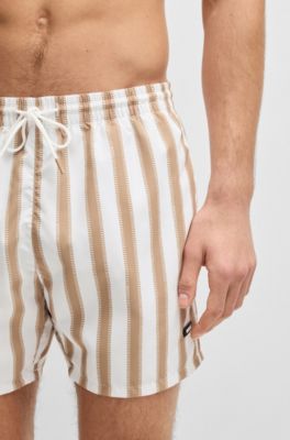 Quick-dry swim shorts with all-over print, White