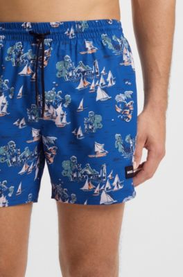 Quick-dry swim shorts with all-over print, Blue