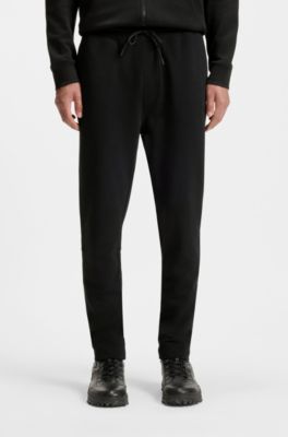 Pantalones de ch&aacute;ndal en felpa de algod&oacute;n con aplique de logo, Negro