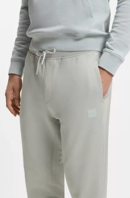 Logo-patch tracksuit bottoms in cotton terry