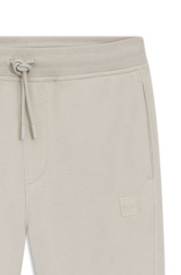 Pantalones de ch&aacute;ndal en felpa de algod&oacute;n con parche de logo, Gris claro