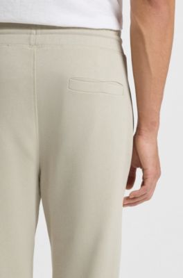 Pantalones de ch&aacute;ndal en felpa de algod&oacute;n con parche de logo, Beige claro