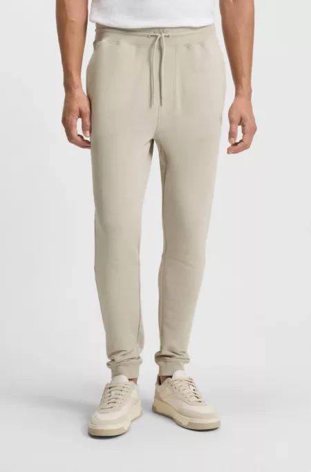 Logo-patch tracksuit bottoms in cotton terry