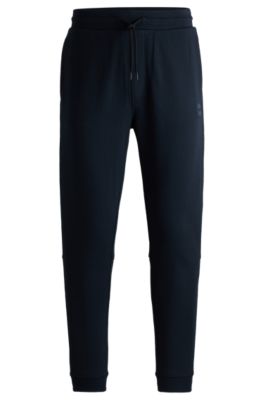Shop Hugo Boss Cotton-terry Tracksuit Bottoms With Logo Patch In Dark Blue