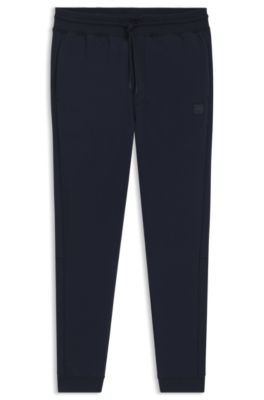 Shop Hugo Boss Cotton-terry Tracksuit Bottoms With Logo Patch In Dark Blue