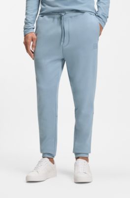 Pantalones de ch&aacute;ndal en felpa de algod&oacute;n con aplique de logo, Celeste