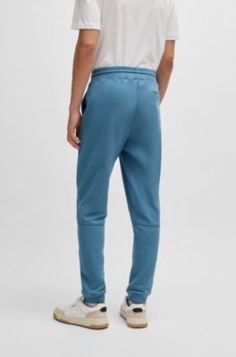 Pantalones de ch&aacute;ndal en felpa de algod&oacute;n con parche de logo, Celeste