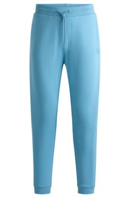 Pantalones de ch&aacute;ndal en felpa de algod&oacute;n con parche de logo, Celeste