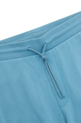 Pantalones de ch&aacute;ndal en felpa de algod&oacute;n con parche de logo, Celeste