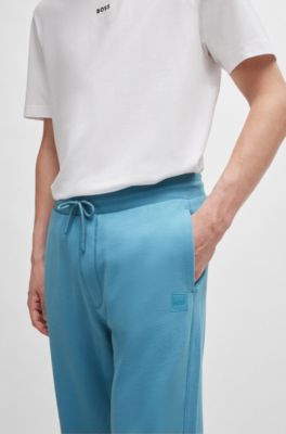 Pantalones de ch&aacute;ndal en felpa de algod&oacute;n con parche de logo, Celeste