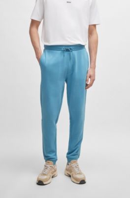 Pantalones de ch&aacute;ndal en felpa de algod&oacute;n con parche de logo, Celeste