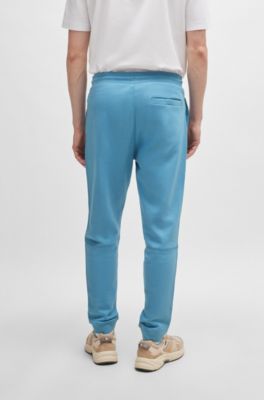 Pantalones de ch&aacute;ndal en felpa de algod&oacute;n con parche de logo, Celeste