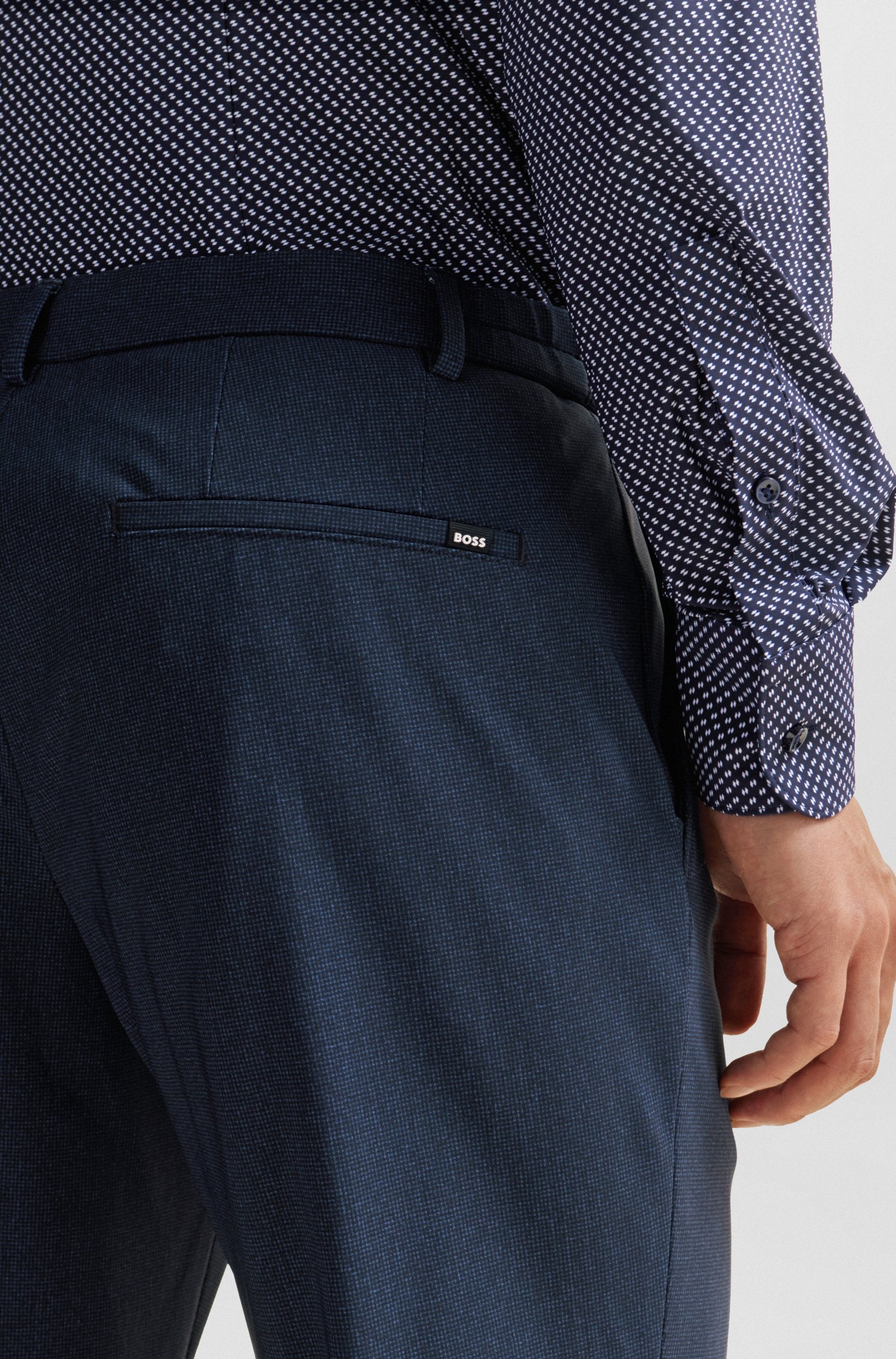 Pantalones slim fit de punto elástico técnico con microdibujo