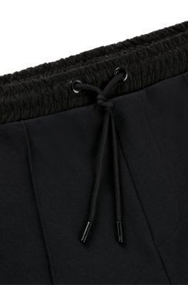 Tracksuit bottoms with pixelated details, Black