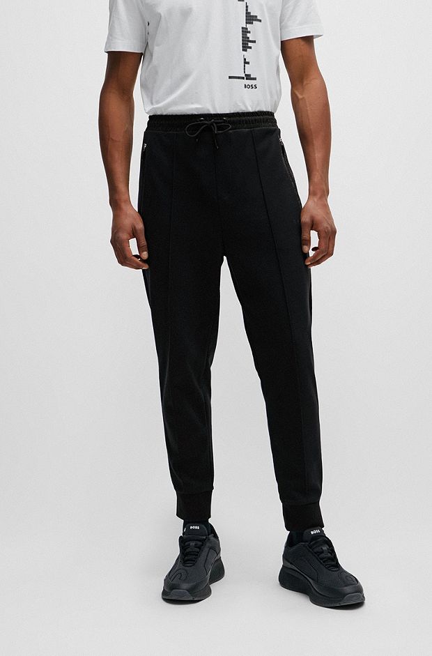 Tracksuit bottoms with pixelated details, Black