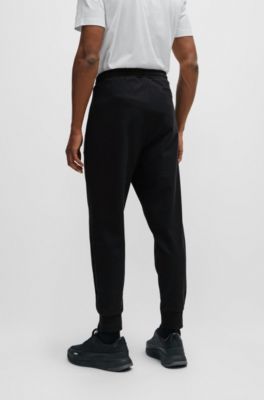 Tracksuit bottoms with pixelated details, Black