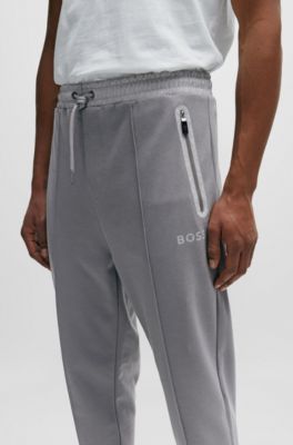 Tracksuit bottoms with pixelated details, Grey