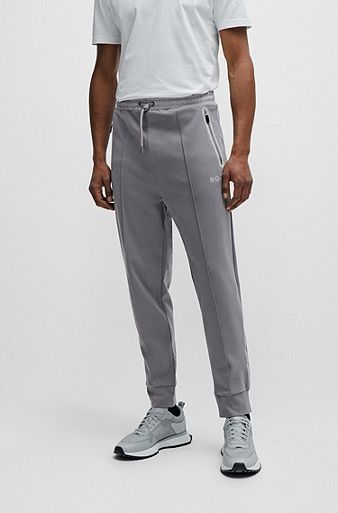Tracksuit bottoms with pixelated details, Grey