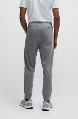 Tracksuit bottoms with pixelated details, Grey