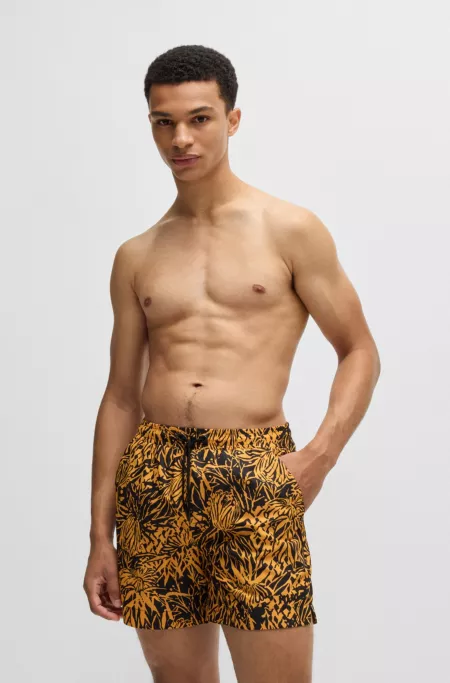 Quick-dry swim shorts with all-over print