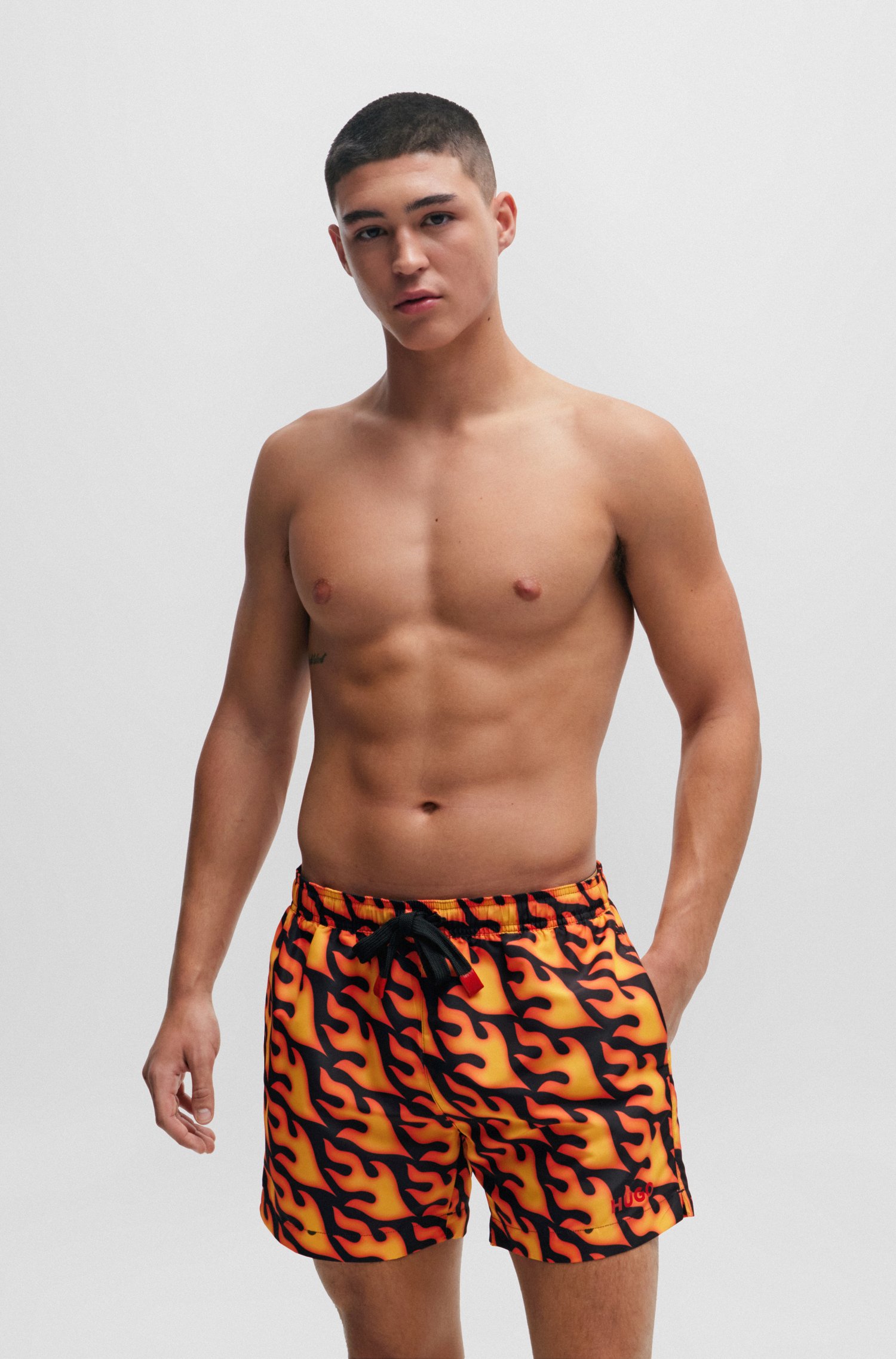 Swim shorts with flame print and logo