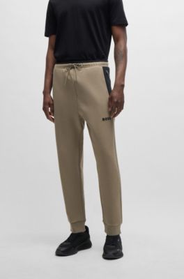 Tracksuit bottoms with 3D-molded logo, Light Green