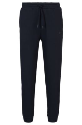 Shop Hugo Boss Cotton-piqu Tracksuit Bottoms With Logo Detail In Dark Blue