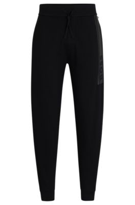 BOSS - Cuffed tracksuit bottoms in French terry with logo print