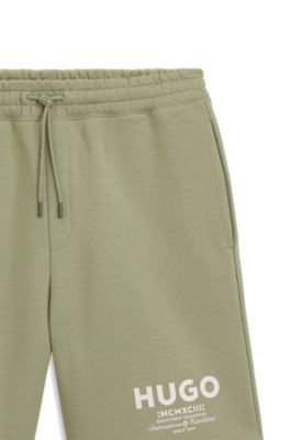Shorts loose fit en felpa de algod&oacute;n con logo estampado, Desbordamiento de color beige