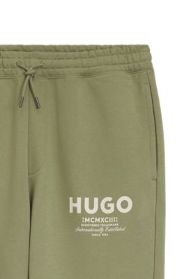 Logo-print tracksuit bottoms in cotton terry, Beige