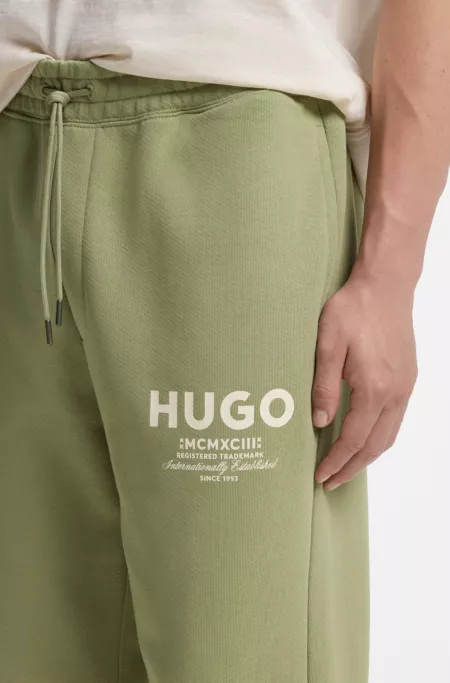 Logo-print tracksuit bottoms in cotton terry