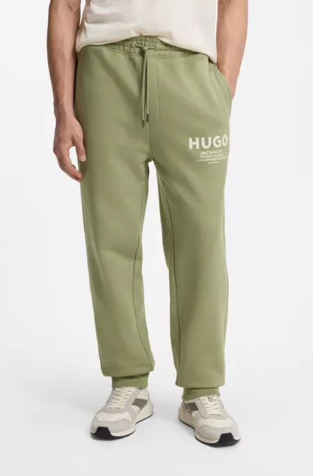 Logo-print tracksuit bottoms in cotton terry