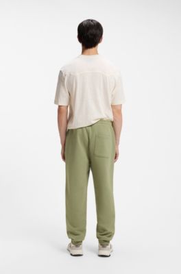 Logo-print tracksuit bottoms in cotton terry, Beige