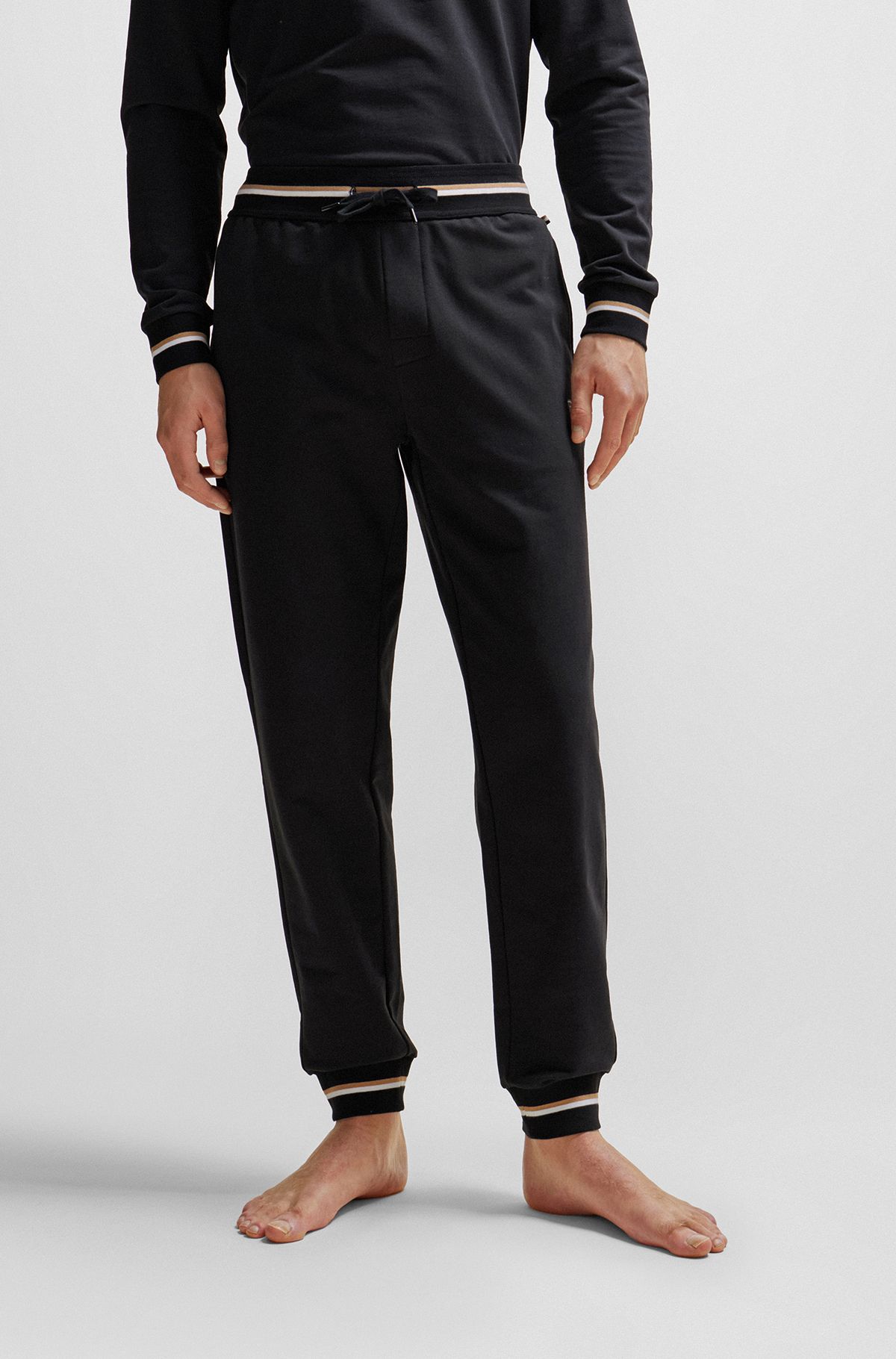 Cotton-terry tracksuit bottoms with logo in signature colors, Black