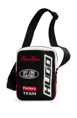 Color-blocked reporter bag with new-season patches, Black