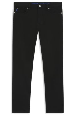 Vaqueros tapered fit en denim el&aacute;stico negro, Negro