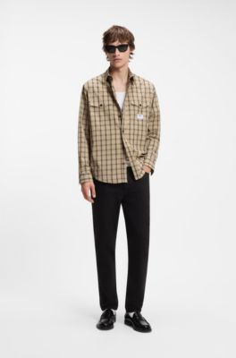 Vaqueros tapered fit en denim el&aacute;stico negro, Negro
