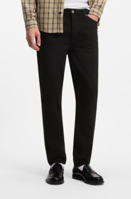 Vaqueros tapered fit en denim el&aacute;stico negro, Negro
