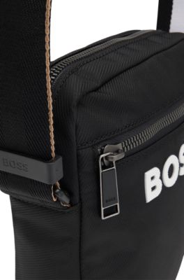 Crossbody bag with signature-stripe strap and contrast logo