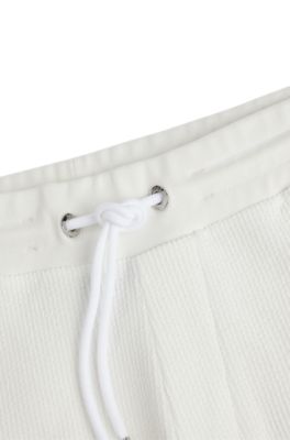 BOSS - Oversize-fit shorts with silver-tone trims 