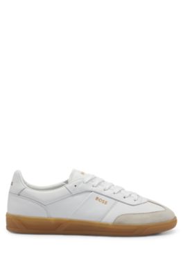 Leather and suede trainers with embossed logos, White