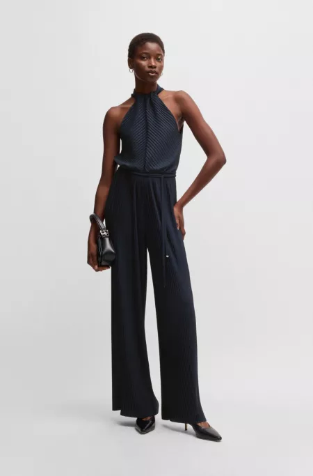 Sleeveless jumpsuit with plissé pleats and tie belt