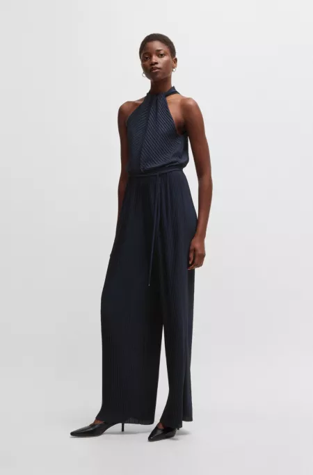 Sleeveless jumpsuit with plissé pleats and tie belt