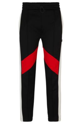 Shop Hugo Relaxed-fit Tracksuit Bottoms With Color-blocking In Black