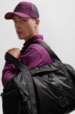 Coated-velour holdall with outline logo and adjustable strap, Black