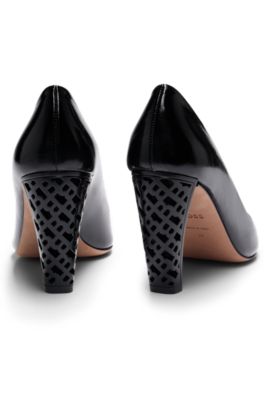 Leather pumps with monogram-patterned heels, Black